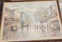 Frontal view of the original mid-century oil painting depicting a Paris cityscape in impasto technique, showing buildings, people, and cloudy sky. Signed at lower right.