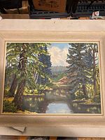 Front view of framed oil painting showing full landscape scene