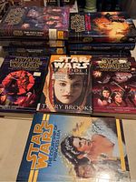 Top view of the book covers showing titles including The Courtship of Princess Leia, Dark Force Rising, The Last Command, Heir to the Empire, Episode I: The Phantom Menace, and The Jedi Path.