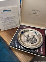 Limited edition Ruffed Grouse sterling silver plate in original box with certificate letter visible.