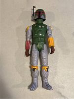 Full body front view of the Boba Fett action figure showing helmet, armor, and color details