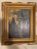 Full front view of the painting in the gold-toned frame showing dark architectural forms under a cloudy sky.