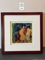 Front view of framed abstract painting with two yellow figures, signed Olga in the corner, set in white mat and dark wood frame.