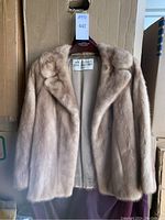 Front view of WM Pinkus Eddie Friedman fox fur coat on hanger