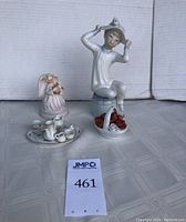 Overview photo showing girl figurine, angel figurine, tea set on tray, and miniature flower basket.