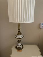 Single lamp unlit showing full base and fabric shade