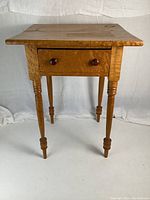 Front view of Bird's Eye maple side table