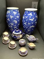 Full lot with 2 tall blue vases, Spode blue mood children's tea set including teapot, sugar bowl, creamer, cups and saucers, plus Genzhel Russian ceramic sugar bowl