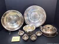 Group shot of all nine sterling silver pieces