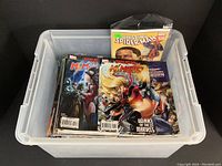 Plastic bin filled with stacked Marvel comic books featuring Ms. Marvel and Spider-Man covers visible.