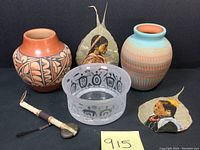 Display of full lot showing two pottery jars, frosted glass bowl, miniature tomahawk, and two hand painted peepal leaves with Native American portraits