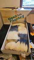 Boxed pair of 1960s Open Country branded fur boots with cream and black fur