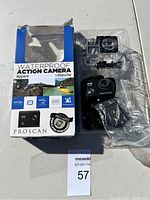 Proscan HD 720P action camera with waterproof case, mounts, and original packaging showing features and included 8GB SD card.