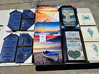 Overview of all wall art items arranged on a table, showing variety of types and designs