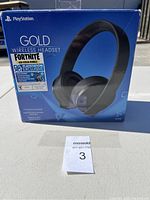 Front view of PlayStation Gold Wireless Headset box with Fortnite Neo Versa Bundle sticker shown clearly on front.