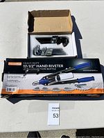 Overview of the heavy duty hand riveter in box and the hex key set in foam packing.