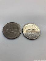 Two 1973 Canadian PEI Silver Dollar coins front and back showing Queen Elizabeth II and Province House, Prince Edward Island