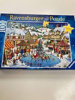 Box front of Ravensburger 1000-piece puzzle showing winter holiday market scene with ice skating, Christmas tree, and snow-covered buildings.