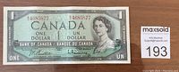 Front of 1954 Canada one dollar banknote showing Queen Elizabeth II portrait and serial number 4685877.