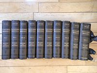 Front view of all 11 bound volumes showing spine titles