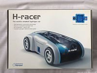 Box cover showing the H-Racer model car with branding and feature highlights like running on renewable hydrogen fuel, no combustion, and inclusion of the hydrogen station and solar panel