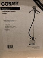 Box label detailing Conair Ultimate Fabric Steamer GS28IHR features and warranty information.