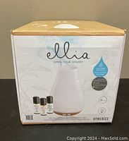 Front view of Ellia diffuser box showing diffuser image and included essential oils.