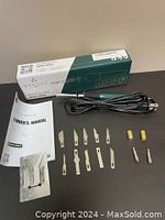 WINONS Hot Knife Tool, model WHK0005, fully unboxed with creator's manual, blades, chucks, chuck sleeves, and stand laid out for display.