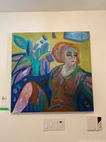 Front view of the painting showing the subject, a woman with orange hair, and colorful floral background.