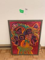 Full view of the framed abstract floral painting showcasing vivid colors and the overall composition.