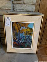 Photo of the framed abstract landscape painting showing overall composition and frame.