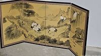 Wide angle shot of the folding screen showing four panels with painted birds, trees, and mountains.