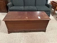 Front view of Lane cedar chest showing full length and carved lower edge detail.