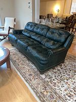 Front angled view showing tufted cushions and overall shape