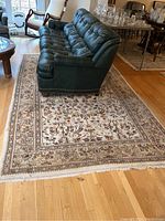 Full view of the handwoven Persian rug laid out under furniture