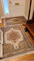 Two rugs laid out in entryway showing full view of both sizes.