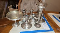 All six sterling silver candleholders including compote, trumpet form, and four round-base holders