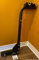 Side view of the Erickson bike rack showing the vertical arm and yellow bicycle frame holders