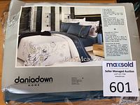 Photo showing packaging of Daniadown Blue Meadow 7 piece duvet cover bedding set with brand and product details.