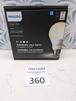 Box of Philips Hue White Starter Kit showing front label with branding and product details.