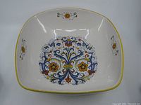 Top view of the square Deruta ceramic bowl showing the full hand-painted floral pattern and yellow rim.