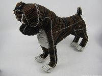 Front angled view of the wire beaded boxer dog figurine showing detailed beadwork and coloration.