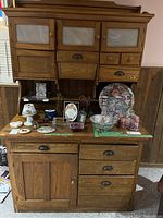 Front view of entire cabinet with contents on countertop