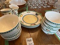 Close-up of plate front showing yellow center and fruit designs