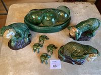 Overview of all items: three monkey statues, four frogs, four glass orbs in bowl