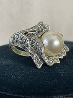 Ring side angle showing pearl center and hematite detailing