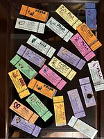 Assorted Phish 1990s concert ticket stubs displayed on black surface