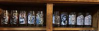 Full view of 10 Star Wars collectible glasses with detailed character graphics from The Empire Strikes Back.