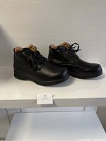 Side angle showing profile and height of ladies black comfort shoes size 39.