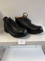Pair of black leather men's comfort shoes in size 45, side view showing details and sole.